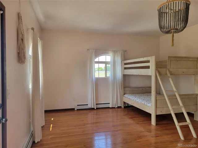 a view of room with wooden floor and window