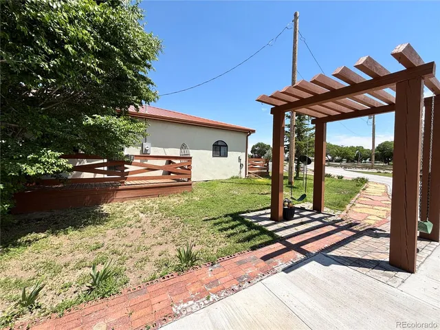 a patio with a yard table and chairs