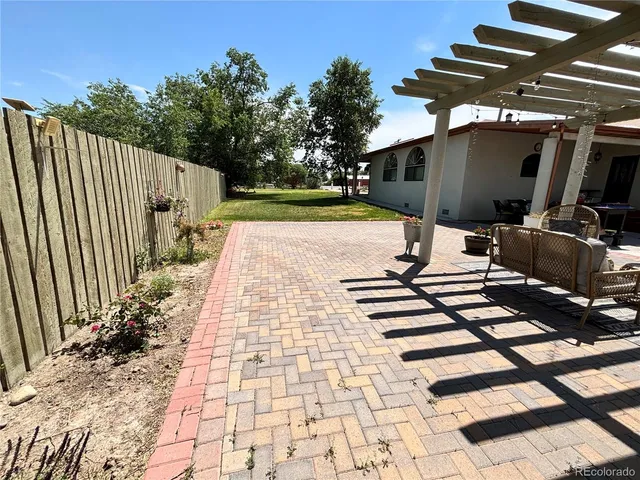 a view of backyard with cabin