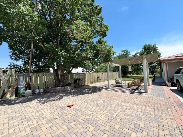 a view of a backyard with a sitting area