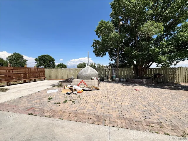 a view of a backyard of the house
