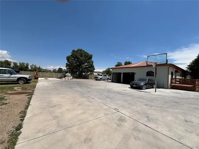 a view of a car park in front of a building