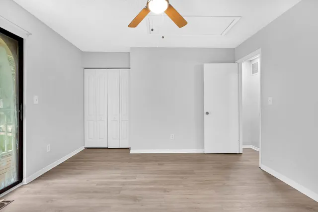 a view of a balcony with wooden floor