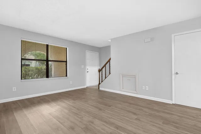 a workspace with furniture and a window