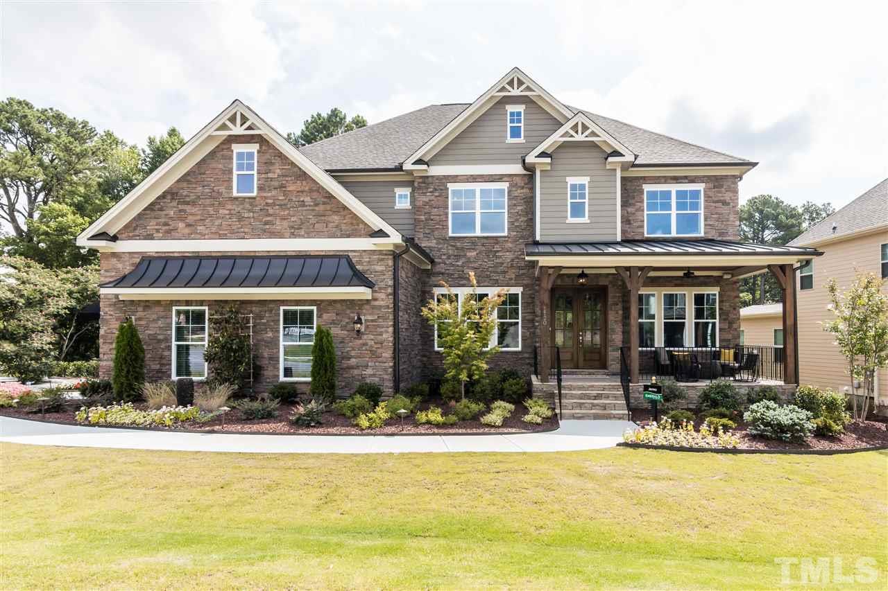 520 Belle Gate Place Cary, NC 27519 - Photo 3 of 25 a view of a house with swimming pool and a porch