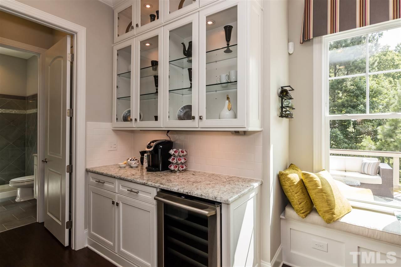 520 Belle Gate Place Cary, NC 27519 - Photo 14 of 25 a kitchen with stainless steel appliances granite countertop a sink and cabinets