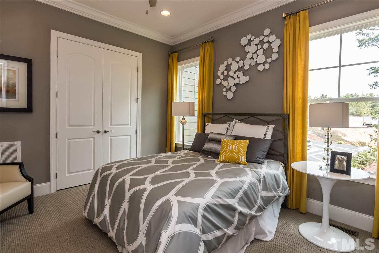 520 Belle Gate Place Cary, NC 27519 - Photo 15 of 25 a bedroom with a large bed and a window