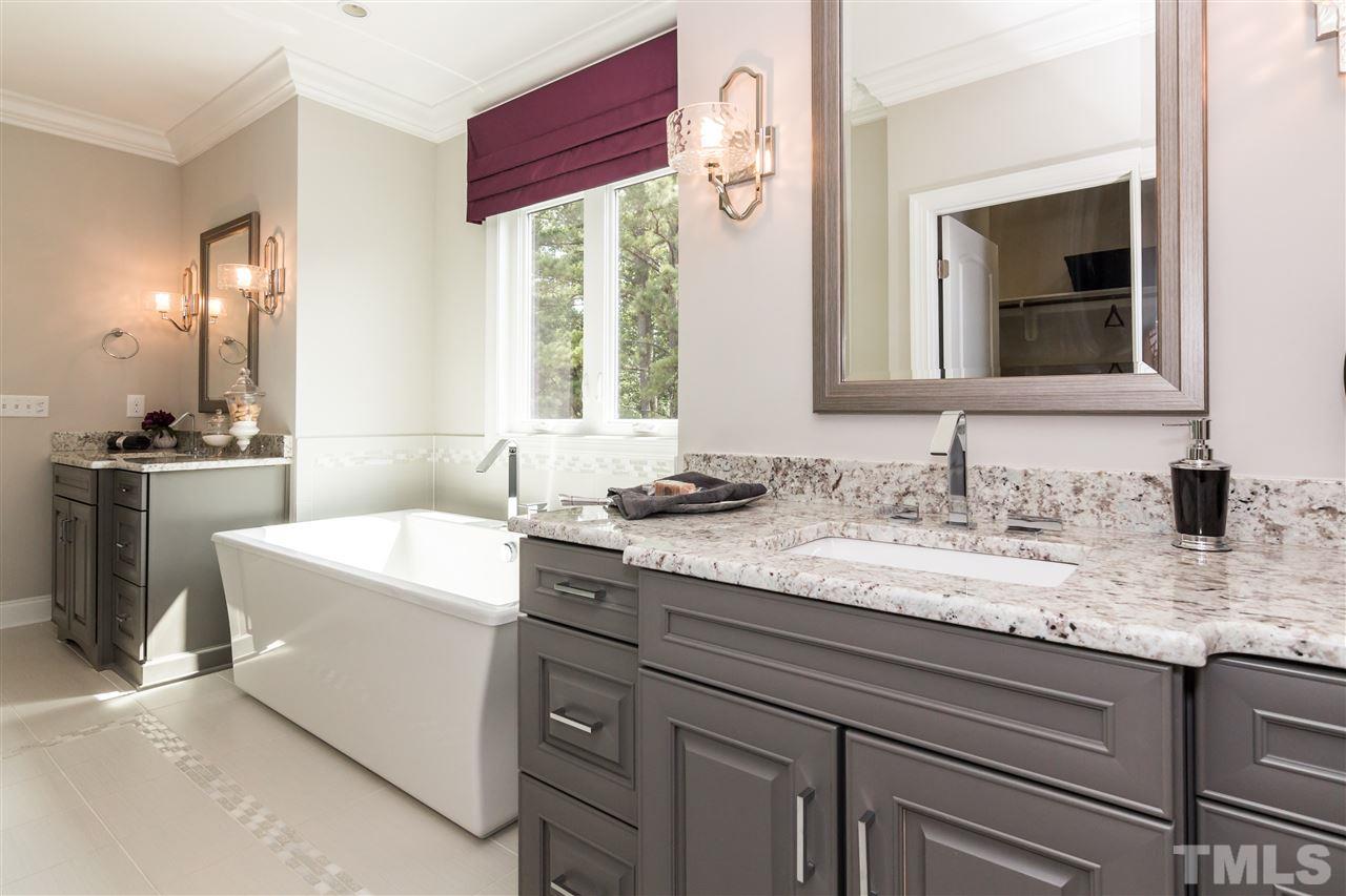 520 Belle Gate Place Cary, NC 27519 - Photo 20 of 25 a bathroom with a granite countertop sink and a mirror