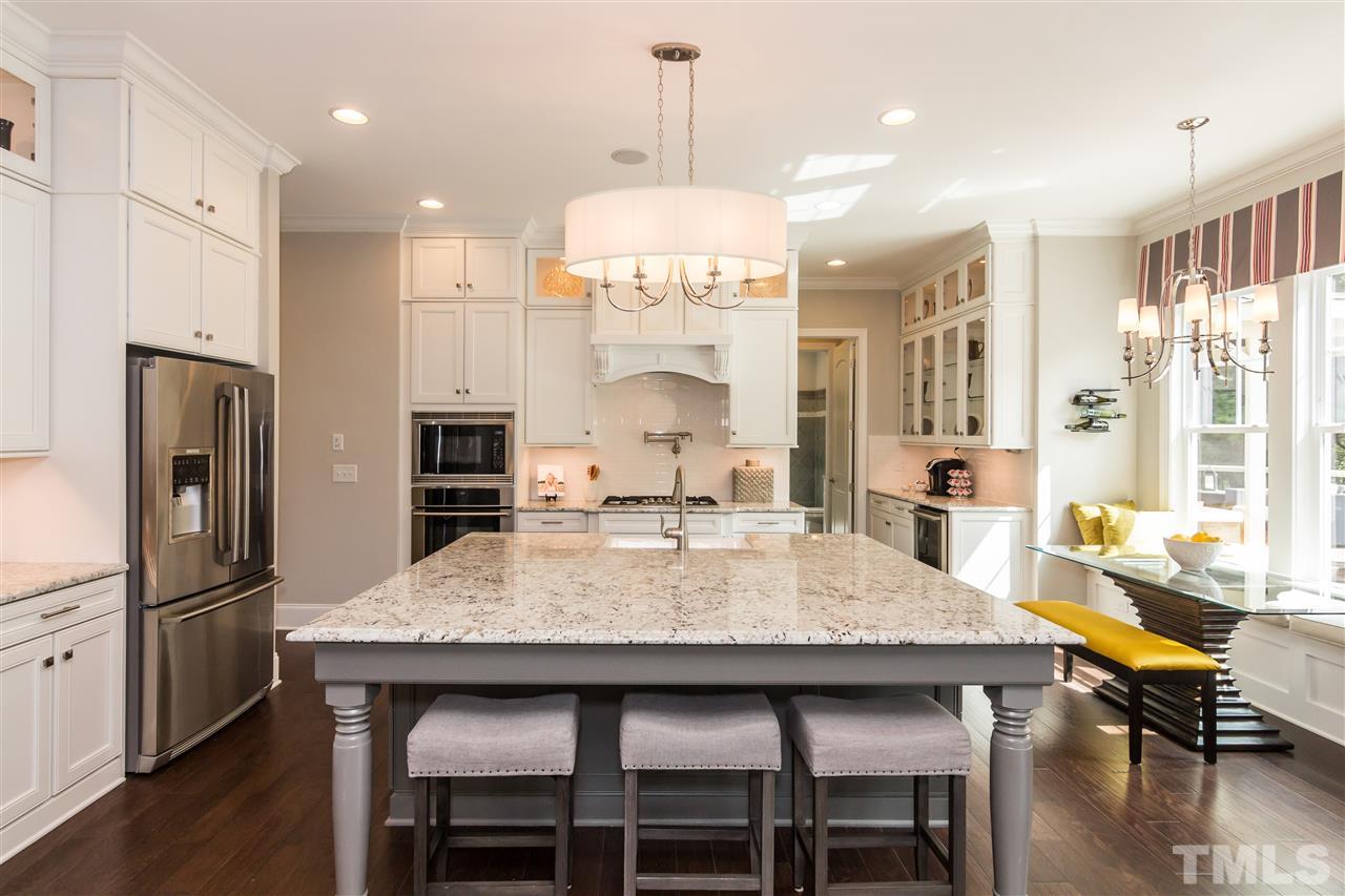 520 Belle Gate Place Cary, NC 27519 - Photo 10 of 25 a view of a dining room with furniture window and wooden floor