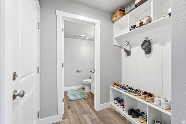 2216 South 1150 West Nibley, UT 84321 - Photo 17 of 34 Entryway mudroom featuring built-in shelving, coat hooks, and shoe storage