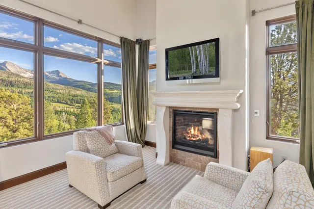 a bedroom with a large bed and a large window