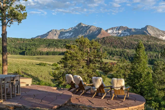 a terrace of a house with outdoor seating