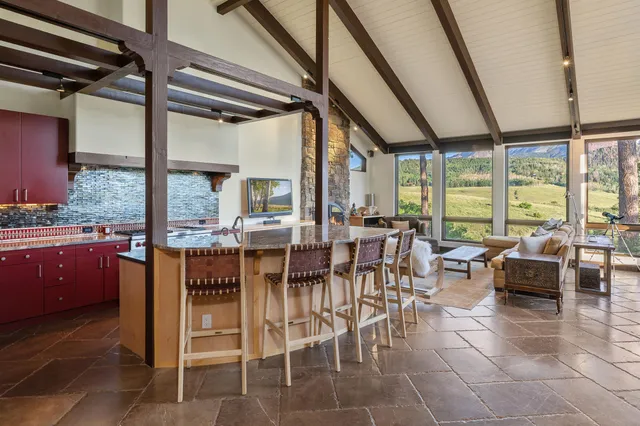 a kitchen with stainless steel appliances granite countertop a sink and cabinets