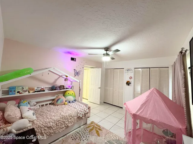 a bathroom with a granite countertop sink toilet and mirror