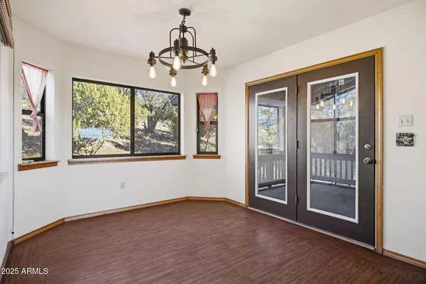 a kitchen view with cabinets a stove and a refrigerator