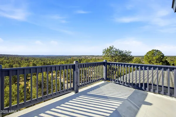 a bathroom with a tub sink vanity granite and a mirror