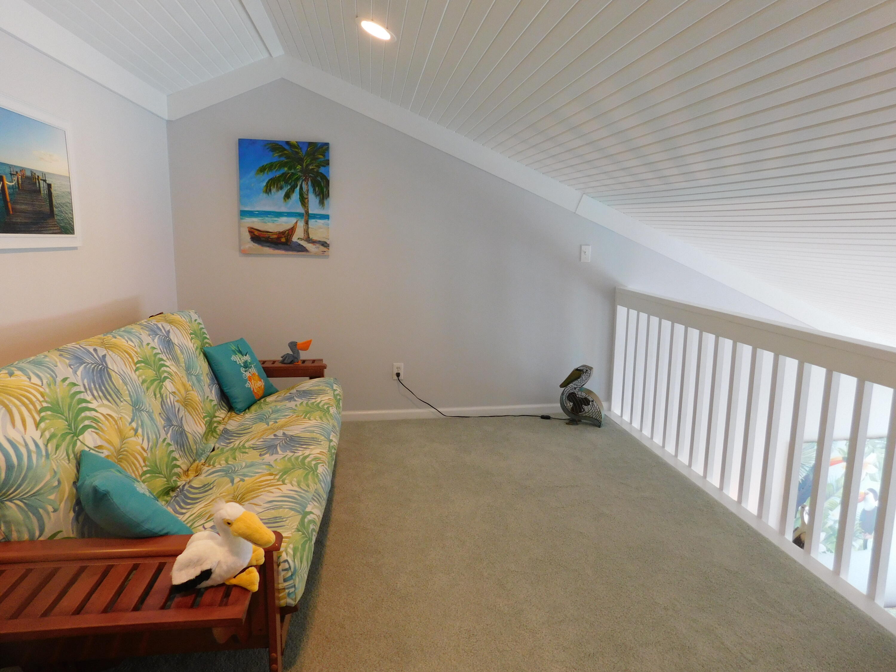 4984 West County Highway 30A, Unit 5B Santa Rosa Beach, FL 32459 - Photo 17 of 46 a view of an bedroom with furniture and ceiling fan