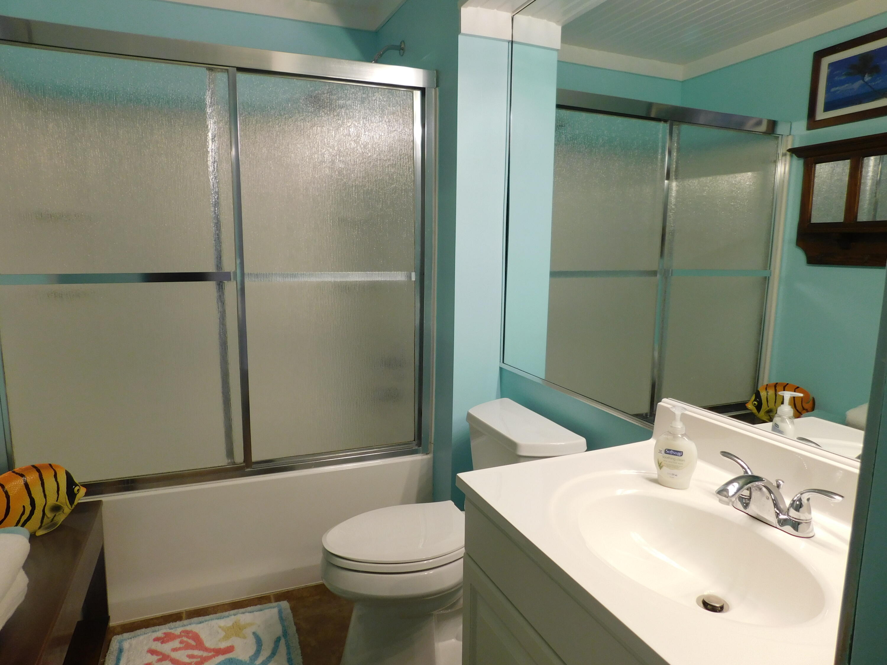 4984 West County Highway 30A, Unit 5B Santa Rosa Beach, FL 32459 - Photo 21 of 46 a bathroom with a sink toilet and shower