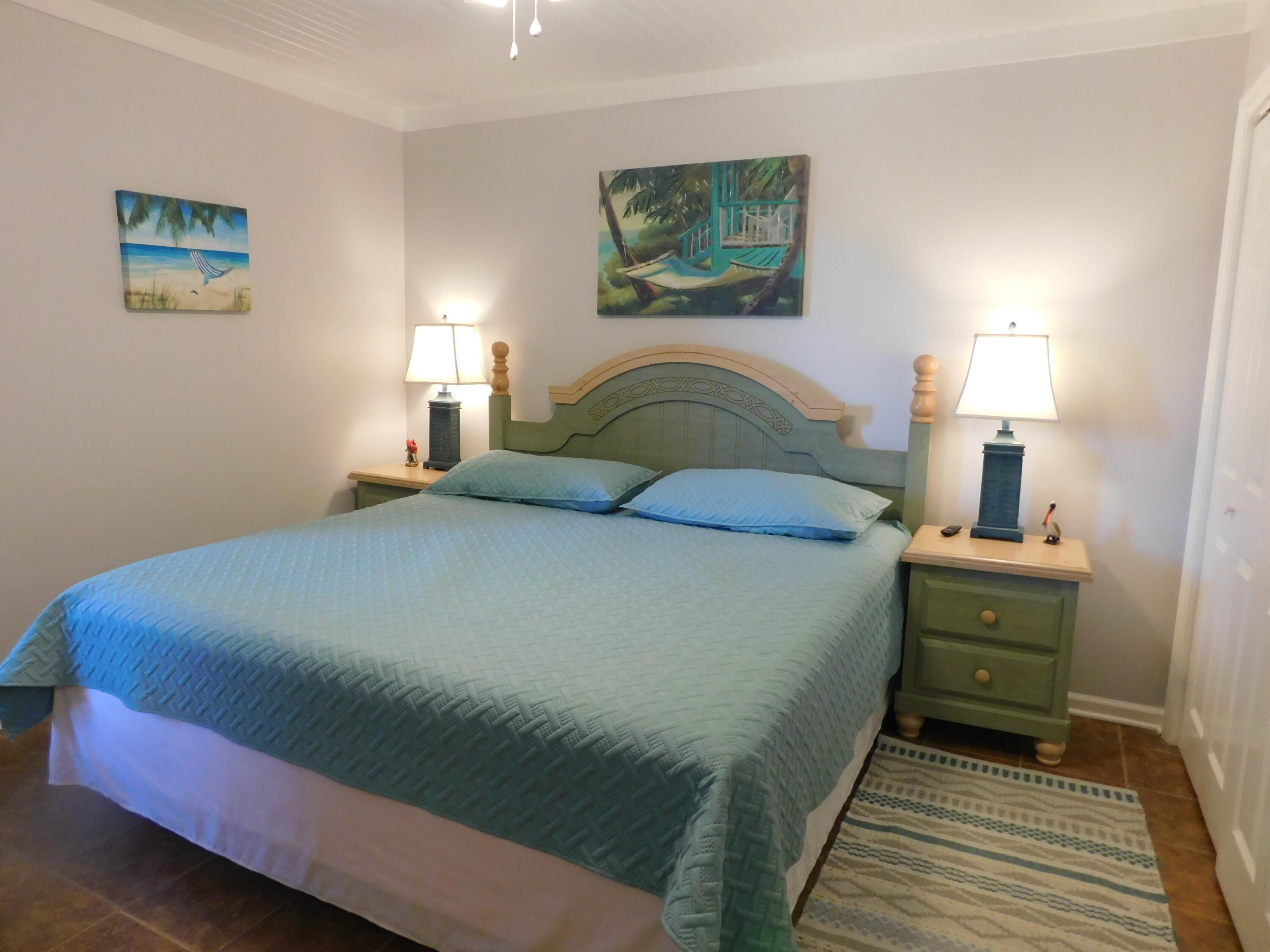 4984 West County Highway 30A, Unit 5B Santa Rosa Beach, FL 32459 - Photo 24 of 46 a bedroom with a bed and a painting on the wall