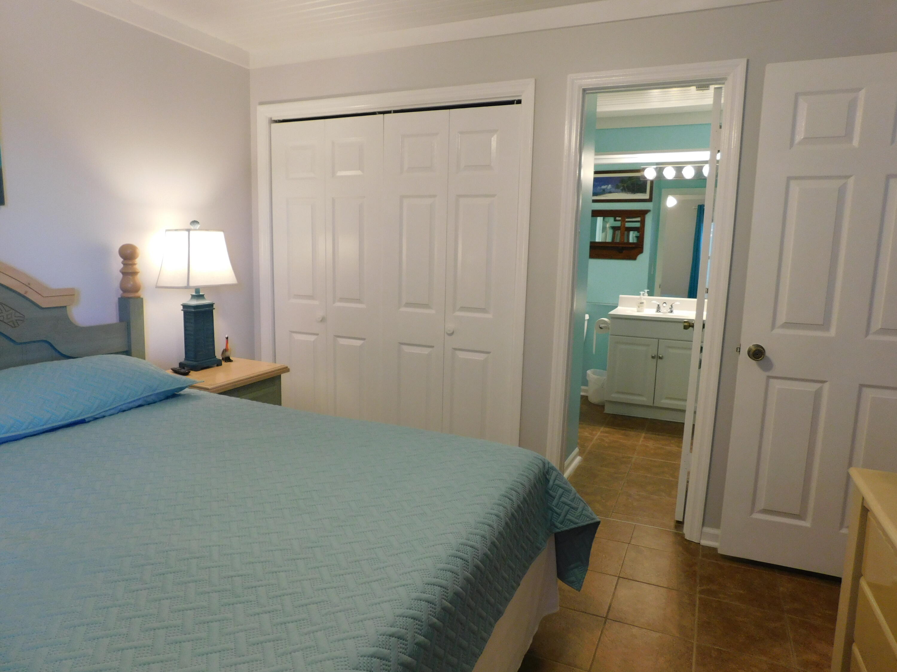 4984 West County Highway 30A, Unit 5B Santa Rosa Beach, FL 32459 - Photo 25 of 46 a bedroom with a bed and a table