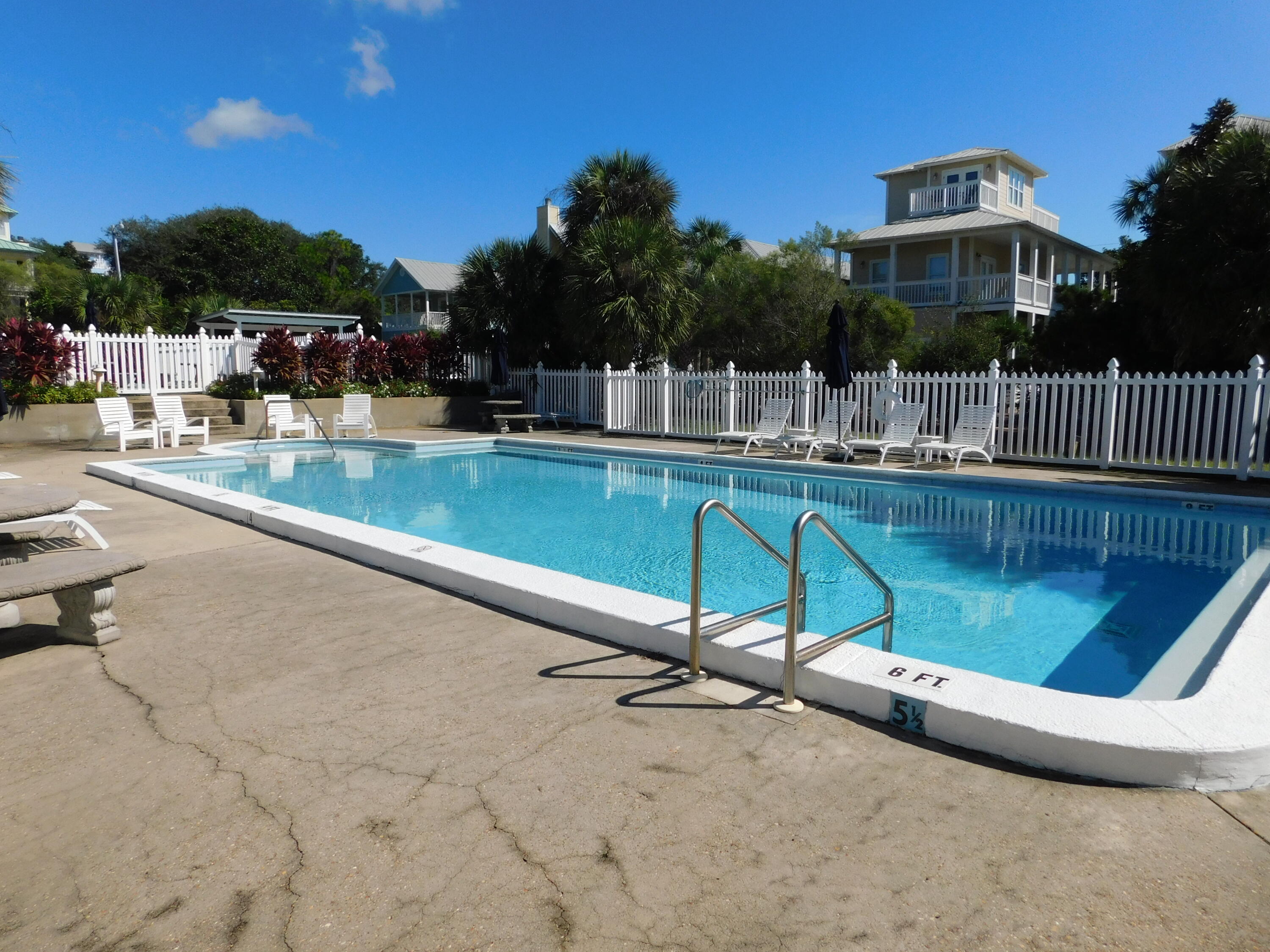 4984 West County Highway 30A, Unit 5B Santa Rosa Beach, FL 32459 - Photo 32 of 46 a view of a swimming pool with a lounge chair