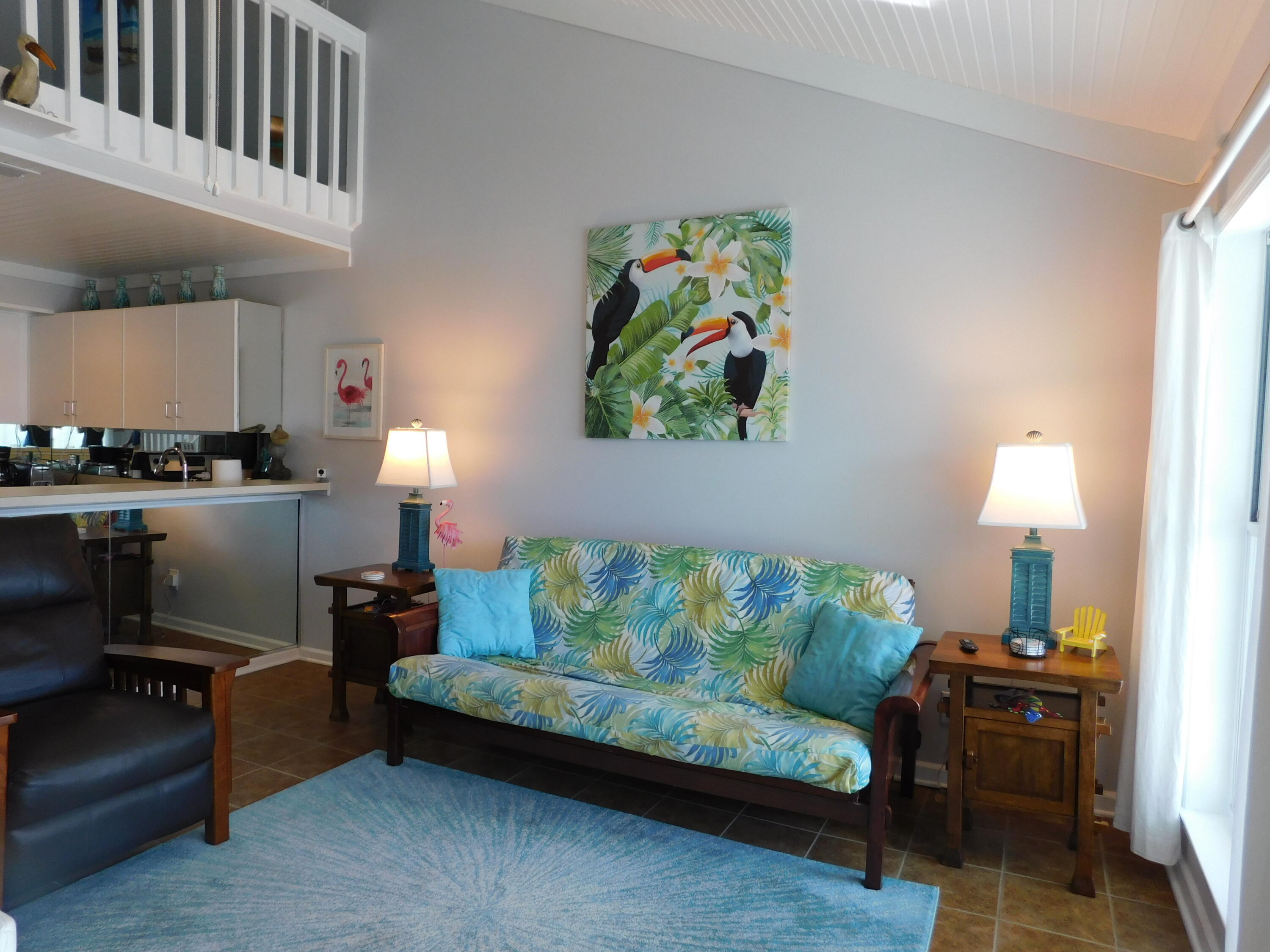 4984 West County Highway 30A, Unit 5B Santa Rosa Beach, FL 32459 - Photo 7 of 46 a living room with furniture and a lamp