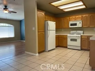 a kitchen with a stove a sink and a refrigerator