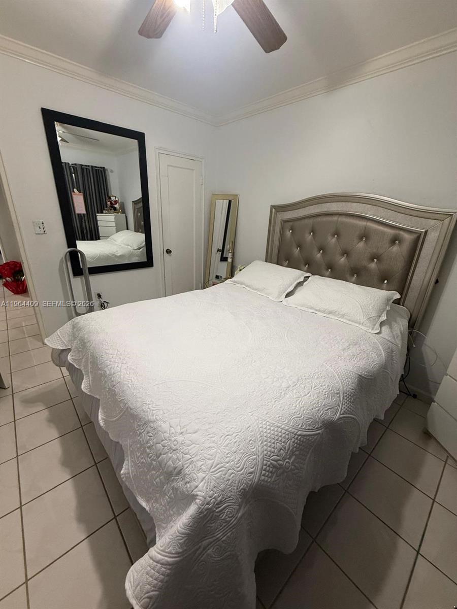 3411 Southwest 11th Street, Unit 3B Miami, FL 33135 - Photo 13 of 14 a bedroom with a bed and a painting on the wall