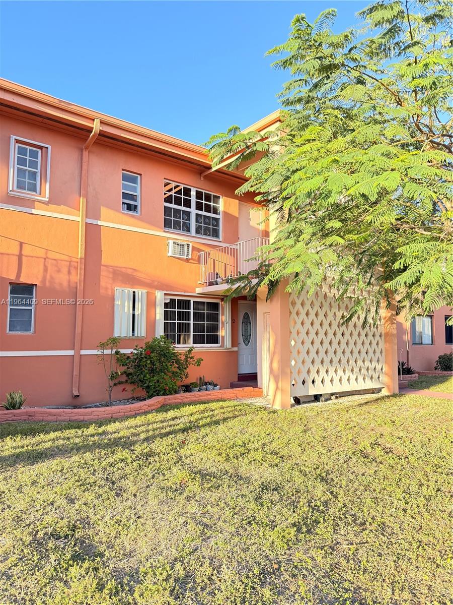 3411 Southwest 11th Street, Unit 3B Miami, FL 33135 - Photo 2 of 14 a front view of a house with a yard