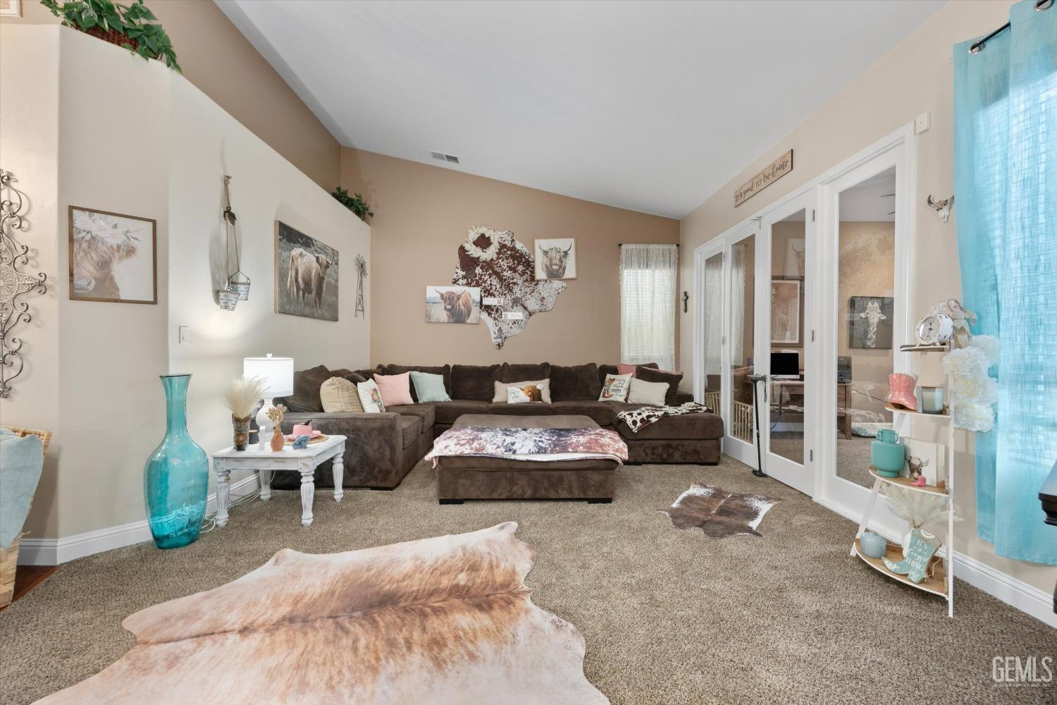 Undisclosed Address Bakersfield, CA 93312 - Photo 12 of 47 a living room with furniture and a rug