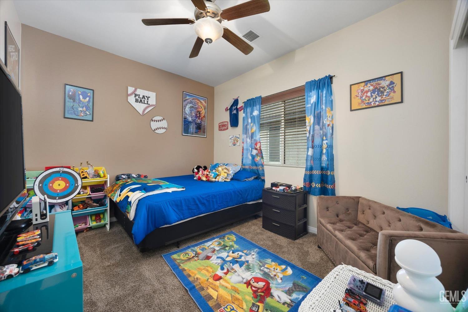 Undisclosed Address Bakersfield, CA 93312 - Photo 14 of 47 a bed sitting in a bedroom next to a window