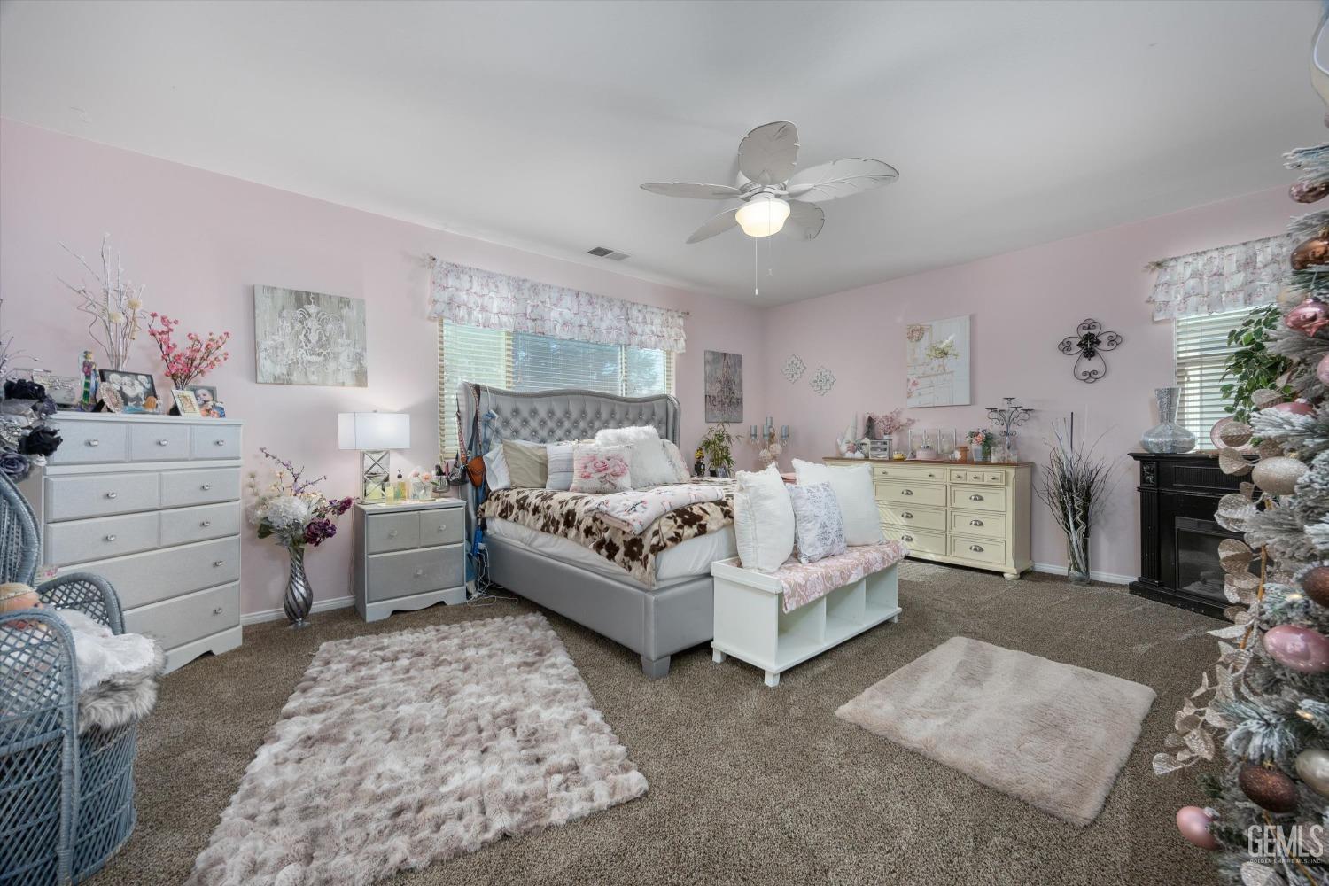 Undisclosed Address Bakersfield, CA 93312 - Photo 23 of 47 a bed room with a bed and a chair