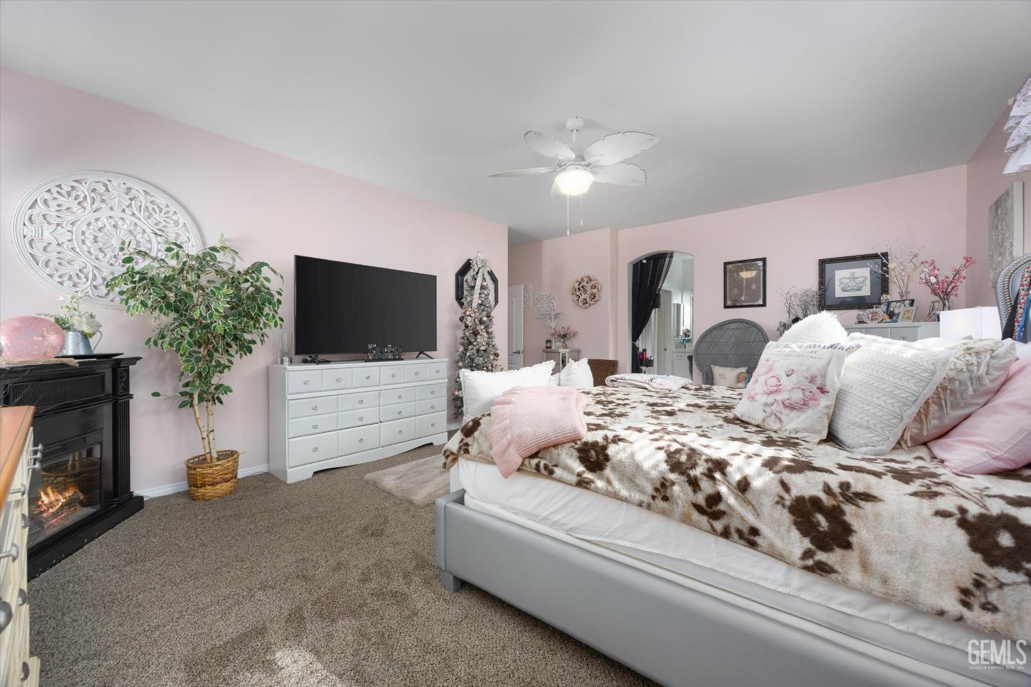 Undisclosed Address Bakersfield, CA 93312 - Photo 25 of 47 a bedroom with a bed and a flat screen tv