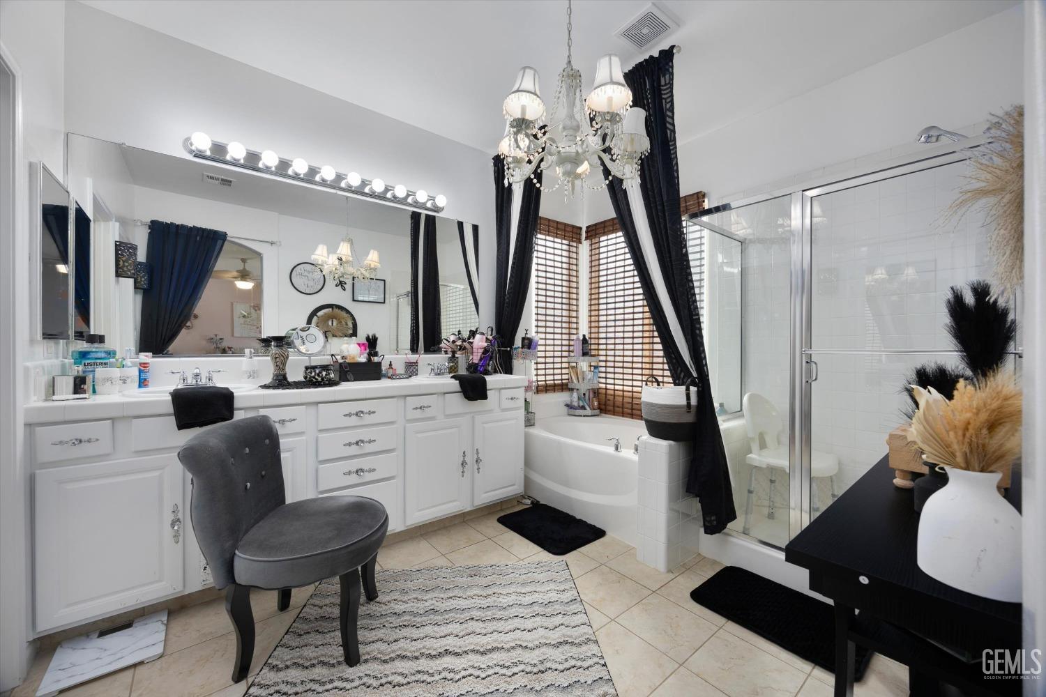 Undisclosed Address Bakersfield, CA 93312 - Photo 26 of 47 a very nice looking room with a large window and a chandelier