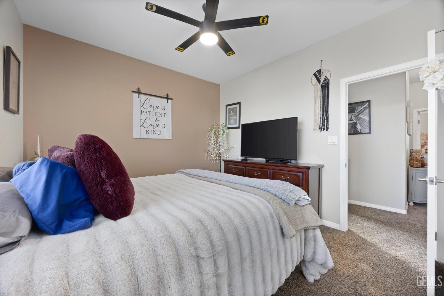 Undisclosed Address Bakersfield, CA 93312 - Photo 31 of 47 a bedroom with a bed and a flat screen tv