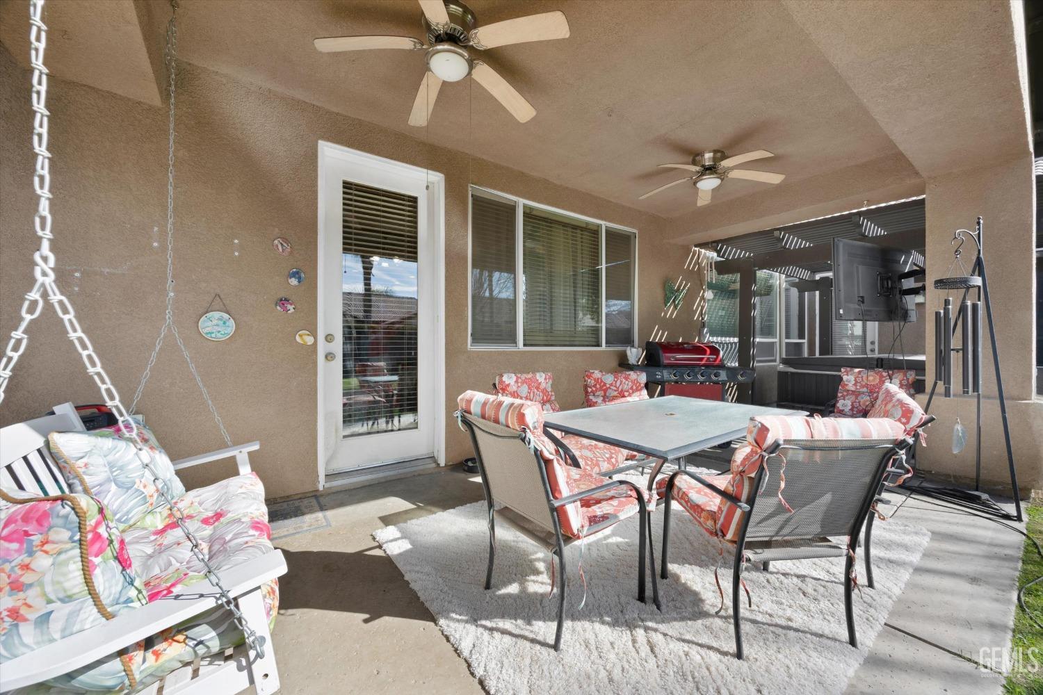 Undisclosed Address Bakersfield, CA 93312 - Photo 35 of 47 a dining room with furniture a rug and a chandelier