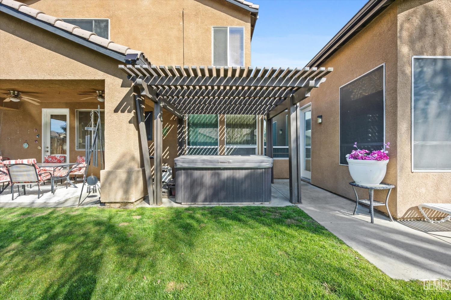 Undisclosed Address Bakersfield, CA 93312 - Photo 36 of 47 a view of a house with a yard and sitting area