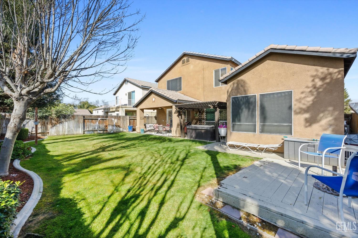 Undisclosed Address Bakersfield, CA 93312 - Photo 39 of 47 a view of a house with backyard and sitting area
