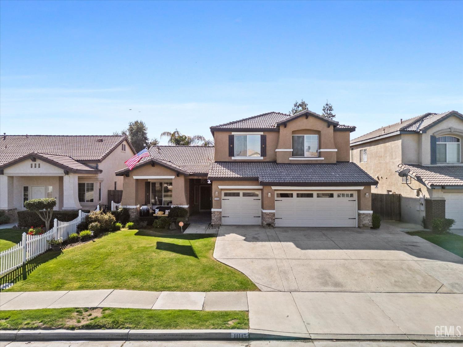 Undisclosed Address Bakersfield, CA 93312 - Photo 45 of 47 a front view of a house with garden