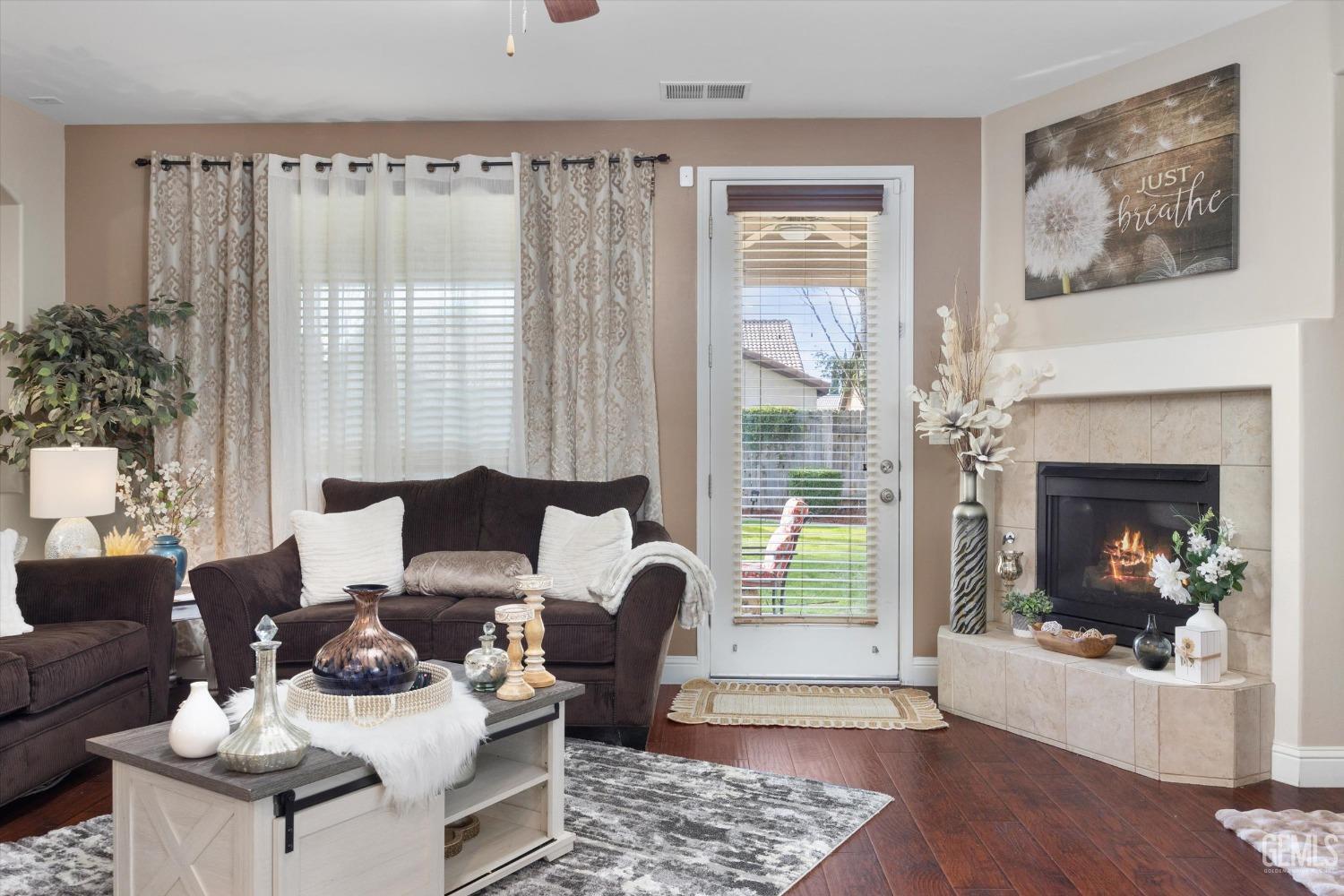 Undisclosed Address Bakersfield, CA 93312 - Photo 6 of 47 a living room with furniture and a fireplace