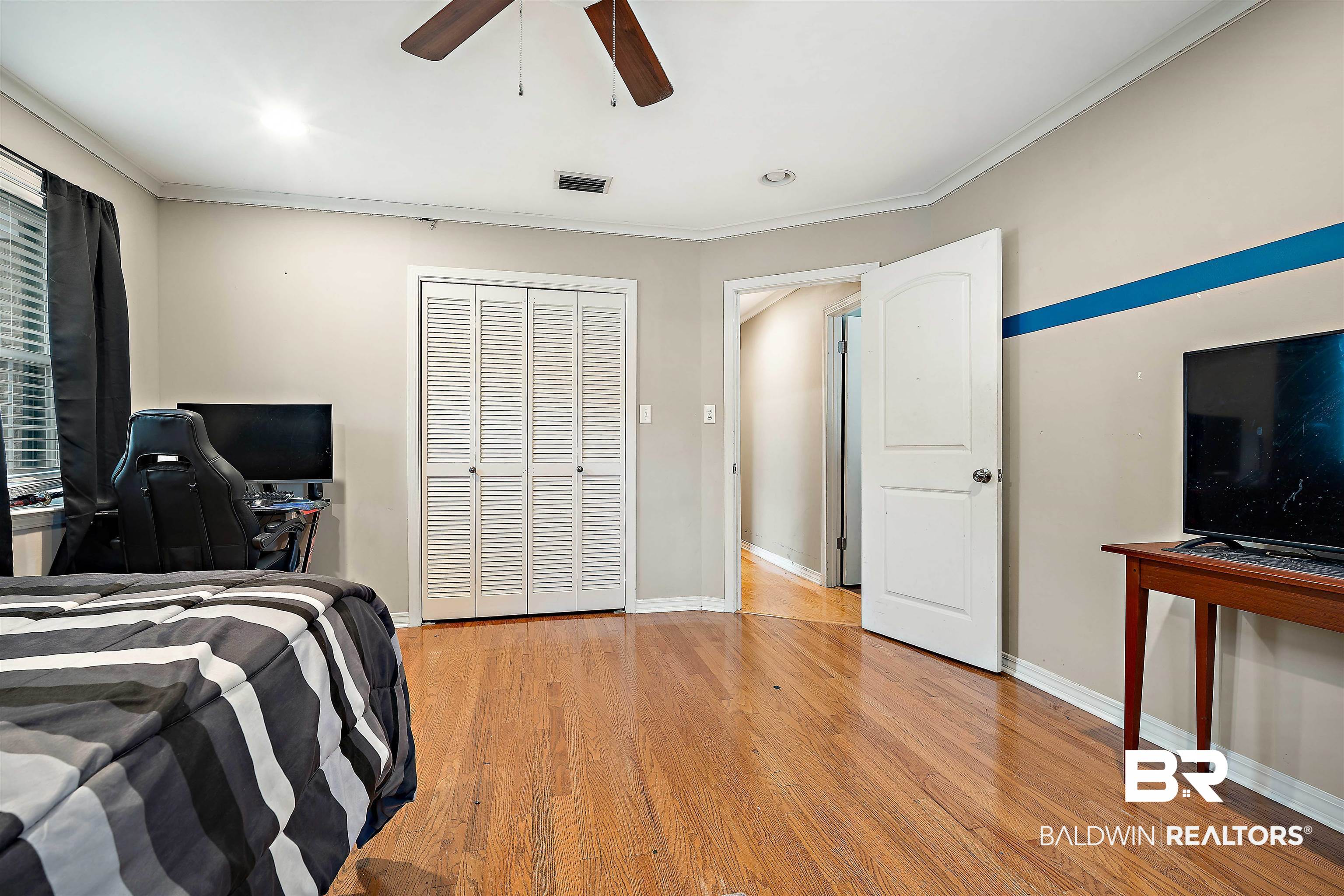 627 Spanish Main Spanish Fort, AL 36527 - Photo 19 of 39 Bedroom with baseboards, visible vents, crown molding, and light wood-style floors