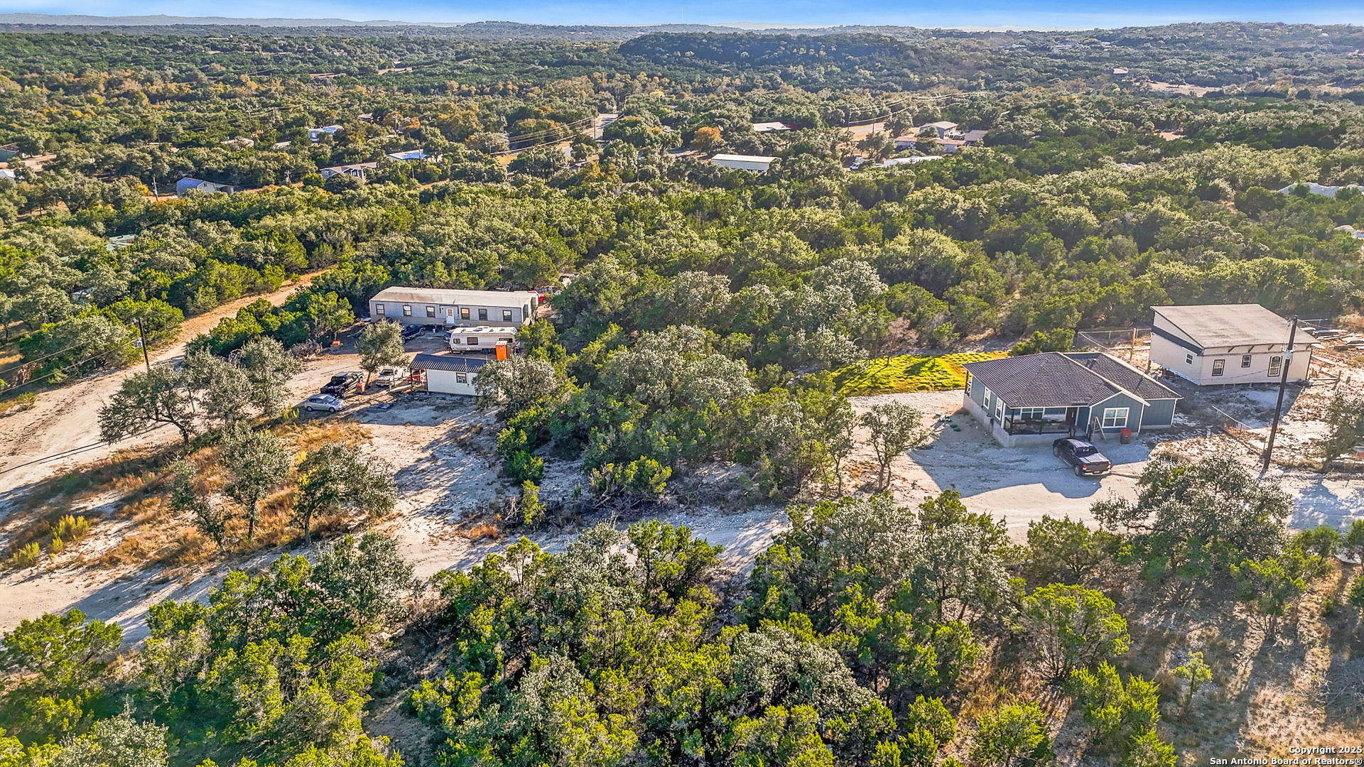 1044 Ken Wayne Drive Spring Branch, TX 78070 - Photo 2 of 12 an aerial view of residential houses with outdoor space