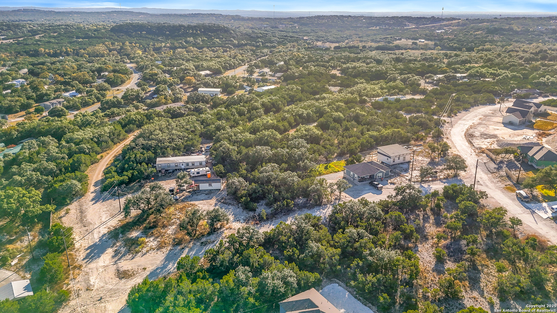 1044 Ken Wayne Drive Spring Branch, TX 78070 - Photo 6 of 12 an aerial view of residential houses with outdoor space