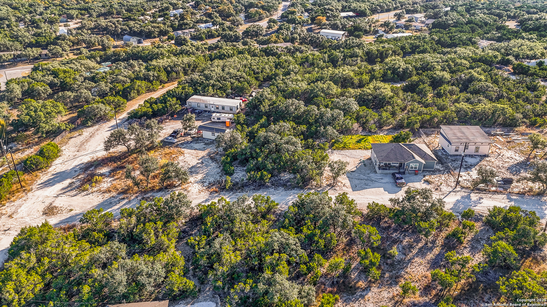 1044 Ken Wayne Drive Spring Branch, TX 78070 - Photo 7 of 12 an aerial view of residential houses with outdoor space and trees