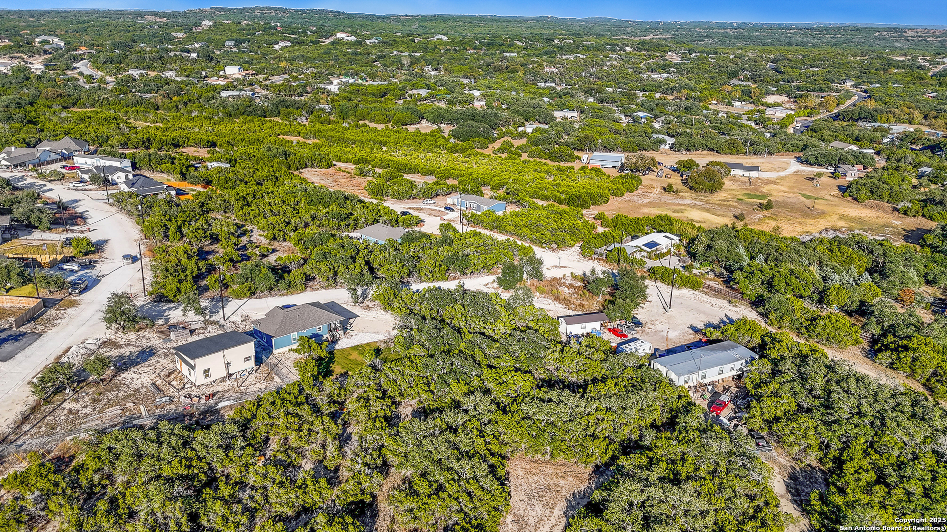 1044 Ken Wayne Drive Spring Branch, TX 78070 - Photo 10 of 12 an aerial view of residential houses with outdoor space and trees