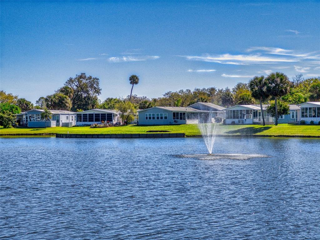 705 Starboard Avenue Edgewater, FL 32141 - Photo 2 of 52 a view of a swimming pool with a yard