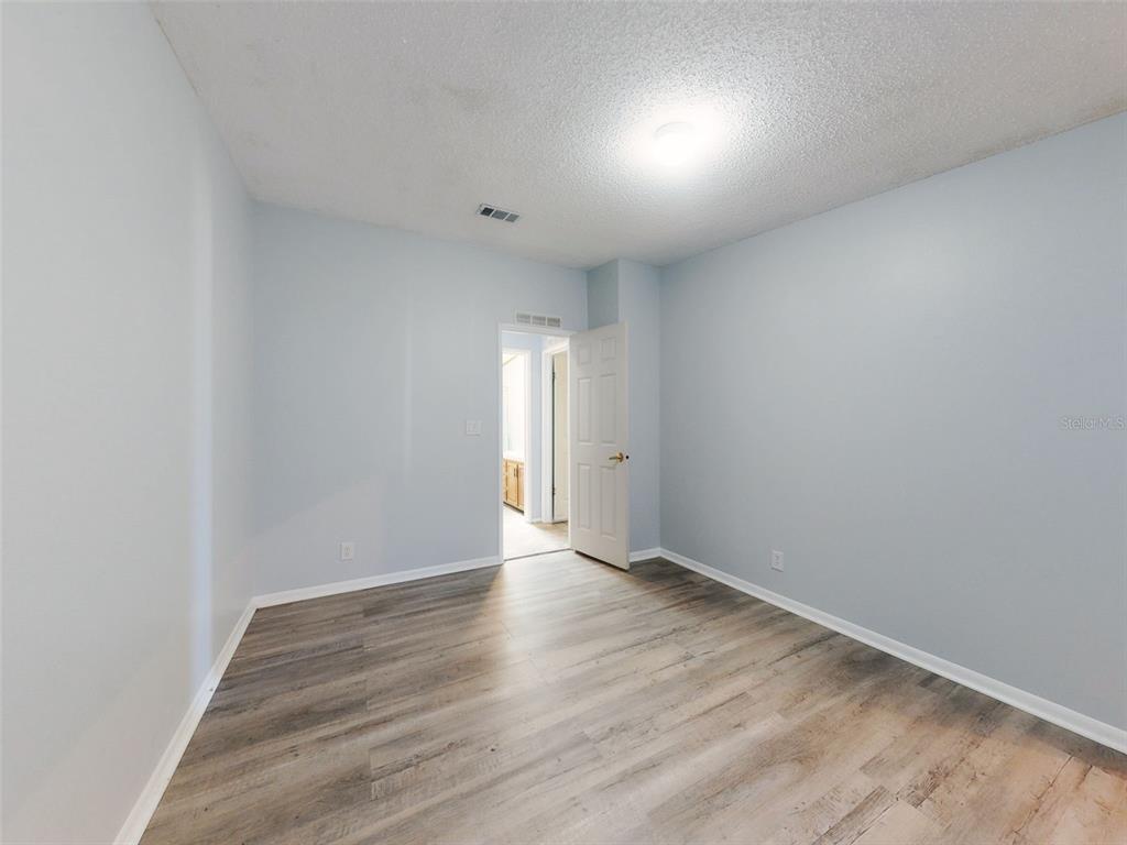 705 Starboard Avenue Edgewater, FL 32141 - Photo 27 of 52 a view of an empty room and wooden floor