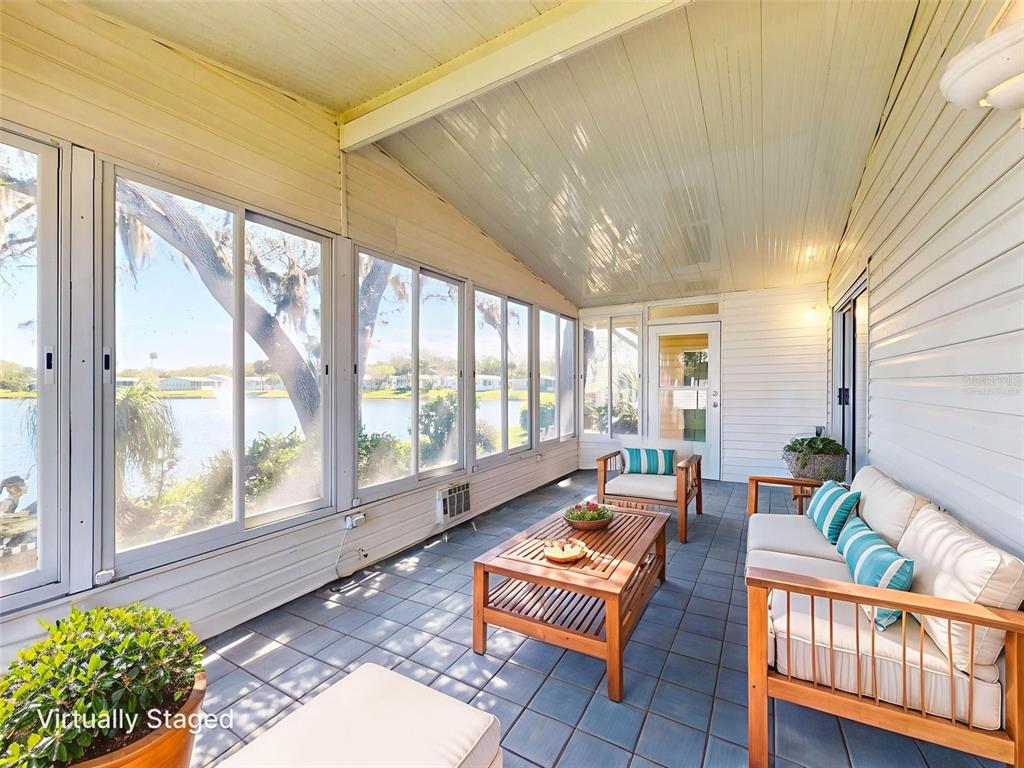 705 Starboard Avenue Edgewater, FL 32141 - Photo 31 of 52 a living room with furniture and a large window