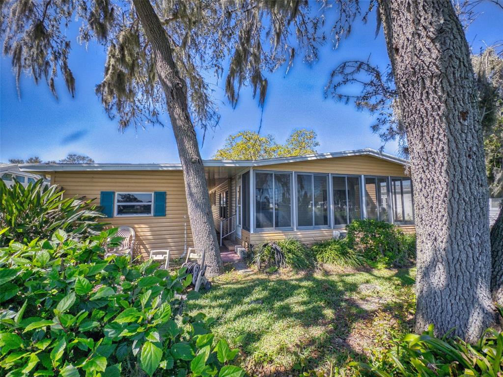 705 Starboard Avenue Edgewater, FL 32141 - Photo 39 of 52 a front view of a house with garden