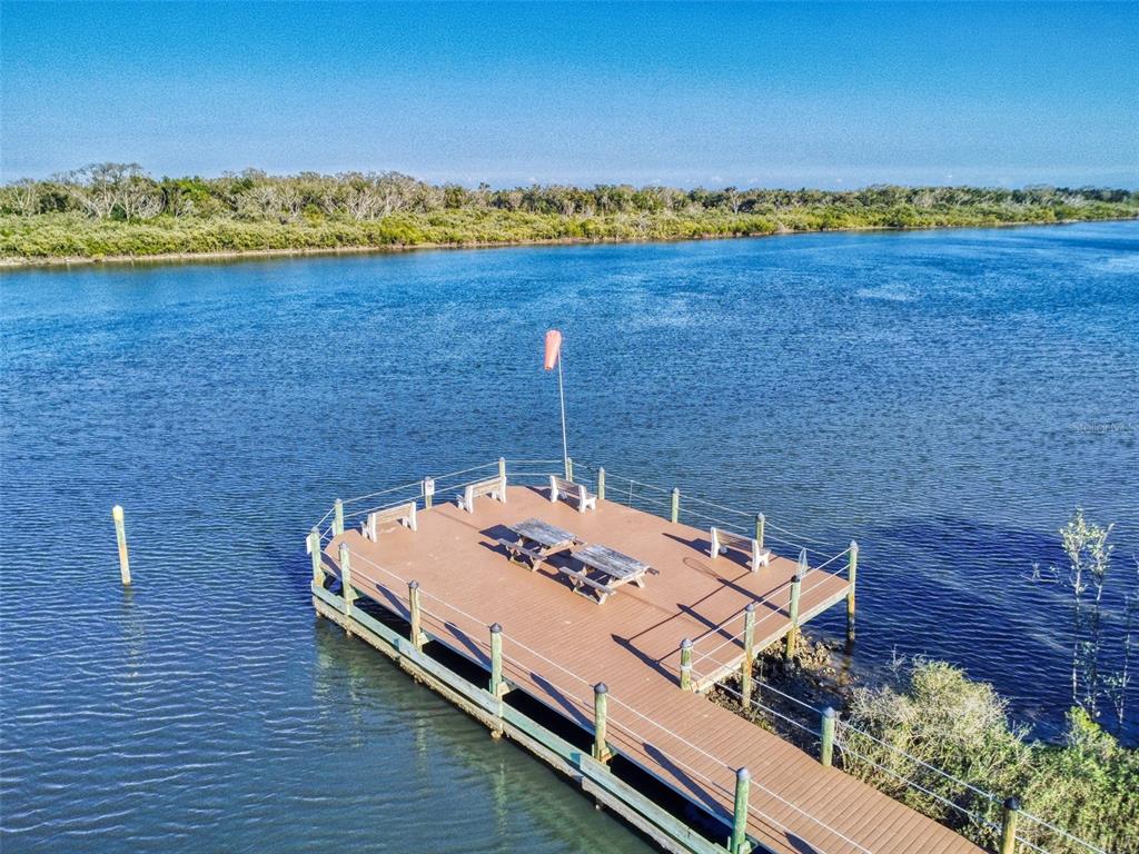 705 Starboard Avenue Edgewater, FL 32141 - Photo 47 of 52 a view of a chairs and table on the wooden floor